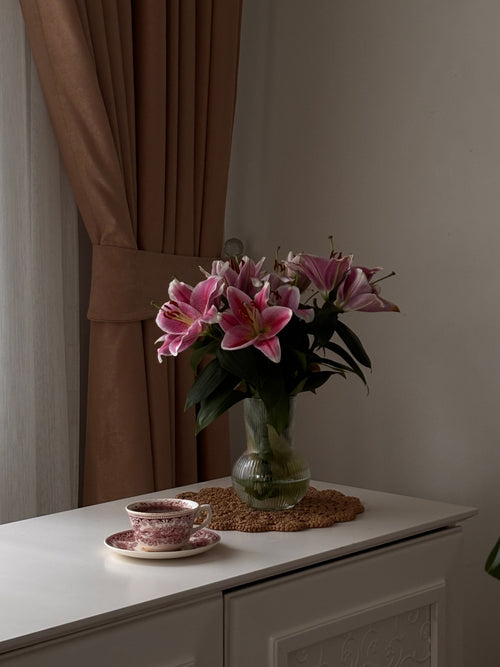 Pink lily bouquet on side table, Bloomin & Buddin lily subscription